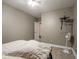 Simple bedroom with neutral paint, carpet, and a wall-mounted TV bracket at 9243 Compton Farm Ln, Indianapolis, IN 46259