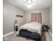 Cozy bedroom with neutral carpet, a ceiling fan, and a bed with a dark blue bed skirt at 9243 Compton Farm Ln, Indianapolis, IN 46259