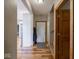 Hallway showcasing wood floors, entry to living space and staircase at 9243 Compton Farm Ln, Indianapolis, IN 46259