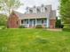 Charming two-story home with a covered front porch and well-maintained lawn at 9243 Compton Farm Ln, Indianapolis, IN 46259