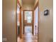 A hallway with wood floors leads to rooms with great lighting at 9243 Compton Farm Ln, Indianapolis, IN 46259