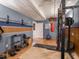 Home gym featuring a weight rack, punching bag, dumbbell rack, and wood paneled walls at 9243 Compton Farm Ln, Indianapolis, IN 46259