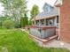 A relaxing hot tub is located on the deck in the backyard of the home at 9243 Compton Farm Ln, Indianapolis, IN 46259