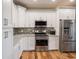 Kitchen featuring stainless steel appliances, granite countertops and subway tile backsplash at 9243 Compton Farm Ln, Indianapolis, IN 46259