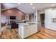Modern kitchen featuring stainless steel appliances and an island with granite countertop at 9243 Compton Farm Ln, Indianapolis, IN 46259