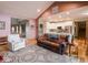 Open-concept living room with a view of the kitchen and front entryway at 9243 Compton Farm Ln, Indianapolis, IN 46259