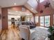 Open-concept living room flowing into the kitchen with vaulted ceilings at 9243 Compton Farm Ln, Indianapolis, IN 46259