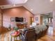 Cozy living room with vaulted ceiling, large TV, and hardwood floors at 9243 Compton Farm Ln, Indianapolis, IN 46259