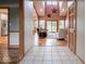 Open-concept layout showing the living room with vaulted ceilings adjacent to the kitchen at 9243 Compton Farm Ln, Indianapolis, IN 46259