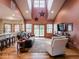 Spacious living room with vaulted ceilings, large windows, and hardwood floors at 9243 Compton Farm Ln, Indianapolis, IN 46259
