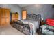 Cozy primary bedroom with a sitting chair and a view of the ensuite bathroom at 9243 Compton Farm Ln, Indianapolis, IN 46259
