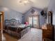 Primary bedroom features vaulted ceilings, two windows and an ensuite bathroom at 9243 Compton Farm Ln, Indianapolis, IN 46259