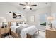 Bedroom with modern ceiling fan, light wood furniture, neutral decor, and a window view at 963 Kempson Ct, Westfield, IN 46074
