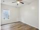 Bedroom with hardwood floors, a window, and a ceiling fan at 963 Kempson Ct, Westfield, IN 46074