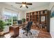 Dedicated office space with custom shelving, large window for natural light, and modern decor at 963 Kempson Ct, Westfield, IN 46074