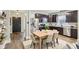 Well-lit kitchen features stainless steel appliances and a wood dining table with seating for six at 963 Kempson Ct, Westfield, IN 46074