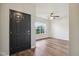 Bright, airy living room with hardwood floors and a large window overlooking the front yard at 963 Kempson Ct, Westfield, IN 46074