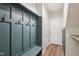 Mudroom area featuring a built-in bench with hooks and sleek design at 963 Kempson Ct, Westfield, IN 46074