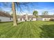 Spacious backyard with well-maintained lawn and mature trees enhancing the property's appeal at 9688 Amber Glow Ct, Fishers, IN 46037