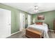 Bedroom with green walls, neutral carpet and bed, with connecting ensuite bathroom at 9688 Amber Glow Ct, Fishers, IN 46037