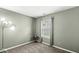 A simple bedroom featuring a window, modern lamp and small accent table at 9688 Amber Glow Ct, Fishers, IN 46037