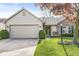 Charming home featuring brick and vinyl siding, a two-car garage, and a well-maintained lawn at 9688 Amber Glow Ct, Fishers, IN 46037