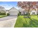 Inviting home exterior with attached garage, well-kept lawn, and tasteful landscaping at 9688 Amber Glow Ct, Fishers, IN 46037