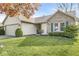 Charming home exterior with brick accents, manicured lawn, and attached two-car garage at 9688 Amber Glow Ct, Fishers, IN 46037