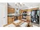Bright kitchen with wood cabinets, granite countertops, and a black refrigerator at 9688 Amber Glow Ct, Fishers, IN 46037
