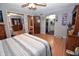 Bedroom with hardwood floors and ensuite bathroom create a functional and stylish space at 1000 Riverview Dr, Martinsville, IN 46151
