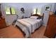 Bedroom with wooden floors, exercise bike and natural light from the windows at 1000 Riverview Dr, Martinsville, IN 46151