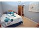 This is a bedroom with neutral walls, wood trim, a queen bed and floral bedding at 1000 Riverview Dr, Martinsville, IN 46151