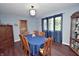 Spacious dining room with a window, display cabinet, and stylish decor, perfect for entertaining and everyday dining at 1000 Riverview Dr, Martinsville, IN 46151