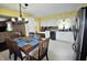 Bright kitchen featuring a dining table, stainless steel appliances, and ample cabinet space at 1000 Riverview Dr, Martinsville, IN 46151