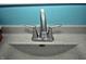 Close-up of a bathroom sink with a neutral stone countertop and stainless steel faucet at 1000 Riverview Dr, Martinsville, IN 46151