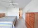Bedroom featuring carpet floors, ceiling fan, and neutral walls perfect for personalization at 10822 Cape Coral Ln, Indianapolis, IN 46229