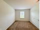 Neutral bedroom with sliding closet doors and a single window for natural light at 10822 Cape Coral Ln, Indianapolis, IN 46229