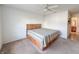 Bedroom showcasing carpet floors, ceiling fan, and neutral walls perfect for personalization at 10822 Cape Coral Ln, Indianapolis, IN 46229