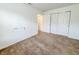 Neutral bedroom with sliding closet doors and lots of natural light at 10822 Cape Coral Ln, Indianapolis, IN 46229