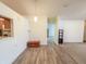 Bright dining area with wood flooring and view to the kitchen at 10822 Cape Coral Ln, Indianapolis, IN 46229