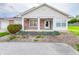 Charming single-story home featuring a brick facade, covered porch, and well-maintained landscaping at 10822 Cape Coral Ln, Indianapolis, IN 46229