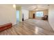 Spacious living room featuring vaulted ceilings, neutral carpet, and large window at 10822 Cape Coral Ln, Indianapolis, IN 46229