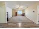 Spacious living room with carpet flooring, neutral walls and a ceiling fan and seamless flow into other rooms at 10822 Cape Coral Ln, Indianapolis, IN 46229
