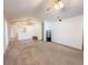 Bright and airy living room featuring neutral walls and an open layout to dining area at 10822 Cape Coral Ln, Indianapolis, IN 46229