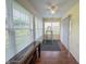 Bright sunroom with lots of natural light, hardwood floors, and ceiling fan for comfortable relaxation at 10822 Cape Coral Ln, Indianapolis, IN 46229