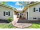 The backyard features a brick walkway, manicured lawn, and a connecting door at 110 W Buckeye St, Cicero, IN 46034