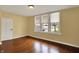 Sunny bedroom with hardwood floors and multiple windows offering plenty of natural light at 110 W Buckeye St, Cicero, IN 46034