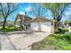 Charming two-story home with an attached two-car garage, complemented by mature trees and landscaping at 110 W Buckeye St, Cicero, IN 46034