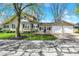 Inviting home with a manicured lawn and mature trees, featuring an attached two-car garage at 110 W Buckeye St, Cicero, IN 46034
