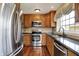 Well-equipped kitchen featuring stainless steel appliances and granite countertops and hardwood floors at 110 W Buckeye St, Cicero, IN 46034